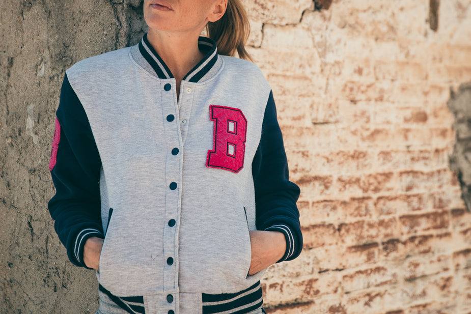 Womens Classic Varsity Top in grey and black with red embroidered letter B and button closure