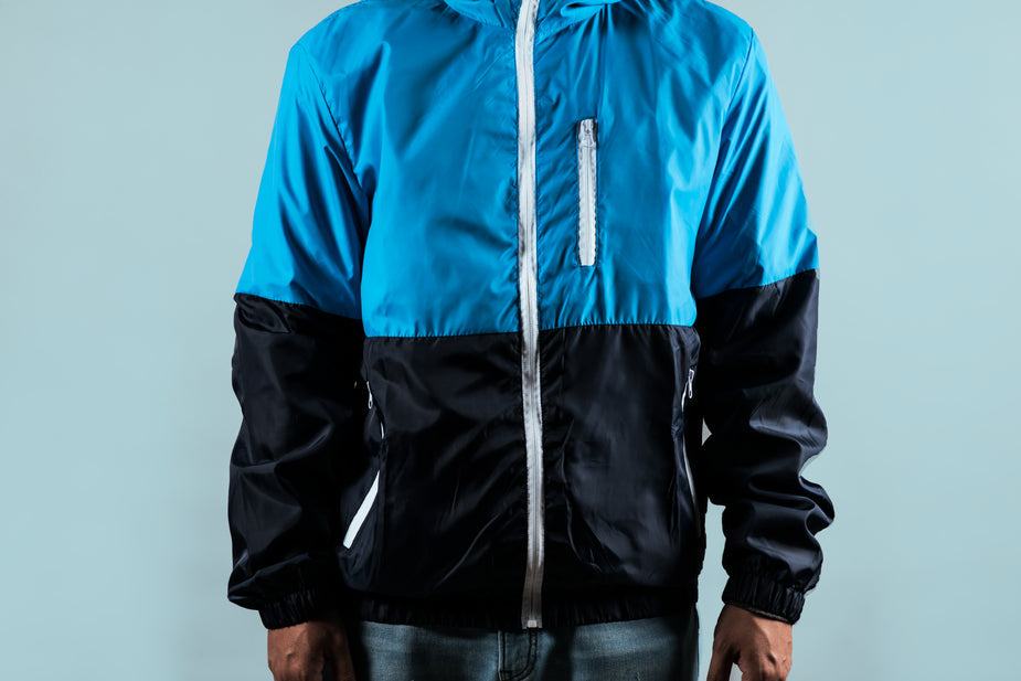 Men's waterproof zipped jacket in dark navy and light blue with chest zip pocket